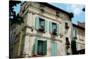 Low Angle View of an Old Building with Flower Pots on Each Window, Rue Des Arenes, Arles-null-Stretched Canvas