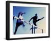 Low Angle View of Athletes Jumping over Hurdles-null-Framed Photographic Print