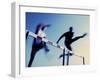 Low Angle View of Athletes Jumping over Hurdles-null-Framed Photographic Print