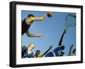 Low Angle View of Group of Young Men Playing Basketball-null-Framed Photographic Print
