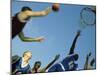 Low Angle View of Group of Young Men Playing Basketball-null-Mounted Photographic Print