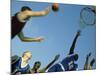 Low Angle View of Group of Young Men Playing Basketball-null-Mounted Photographic Print