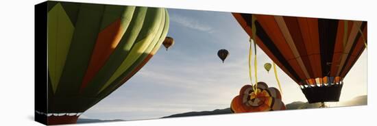 Low angle view of hot air balloons in a balloon festival, Taos Balloon Fiesta, Taos, Taos County...-null-Stretched Canvas