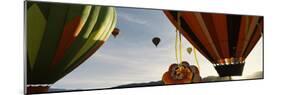 Low angle view of hot air balloons in a balloon festival, Taos Balloon Fiesta, Taos, Taos County...-null-Mounted Photographic Print