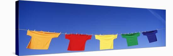 Low Angle View of T-Shirts Hanging on a Clothesline-null-Stretched Canvas