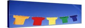 Low Angle View of T-Shirts Hanging on a Clothesline-null-Stretched Canvas