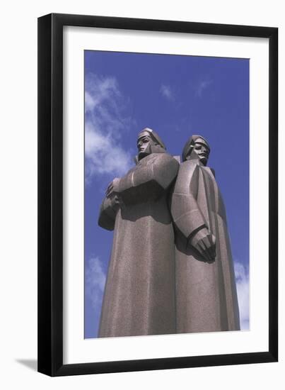 Low Angle View of Two Statues, Red Latvian Riflemen, Riga, Latvia-null-Framed Giclee Print