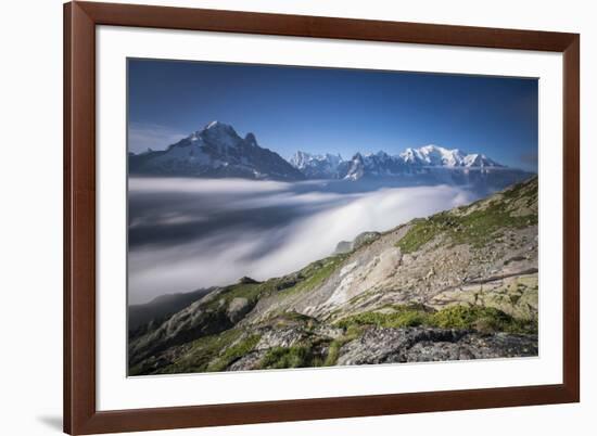 Low clouds and mist frame the snowy peaks of Mont Blanc and Aiguille Verte Chamonix Haute Savoie Fr-ClickAlps-Framed Photographic Print