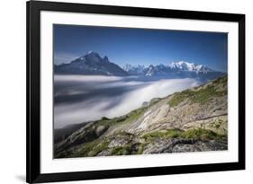 Low clouds and mist frame the snowy peaks of Mont Blanc and Aiguille Verte Chamonix Haute Savoie Fr-ClickAlps-Framed Photographic Print