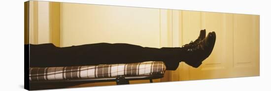 Low Section View of a Man Lying on the Bed, Germany-null-Stretched Canvas