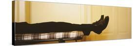 Low Section View of a Man Lying on the Bed, Germany-null-Stretched Canvas