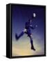 Low Section View of a Soccer Player Jumping in Mid Air to Head a Soccer Ball-null-Framed Stretched Canvas