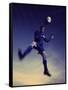Low Section View of a Soccer Player Jumping in Mid Air to Head a Soccer Ball-null-Framed Stretched Canvas