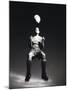 Low Section View of a Soccer Player Jumping in Mid Air to Head a Soccer Ball-null-Mounted Photographic Print