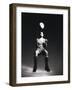 Low Section View of a Soccer Player Jumping in Mid Air to Head a Soccer Ball-null-Framed Photographic Print