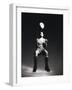 Low Section View of a Soccer Player Jumping in Mid Air to Head a Soccer Ball-null-Framed Photographic Print