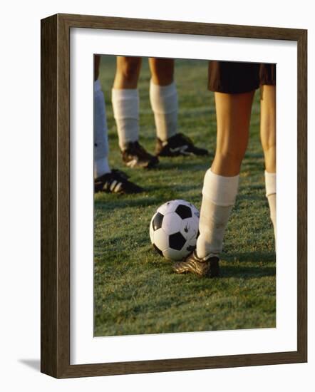 Low Section View of Soccer Players Feet and a Soccer Ball-null-Framed Photographic Print