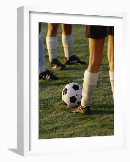 Low Section View of Soccer Players Feet and a Soccer Ball-null-Framed Photographic Print