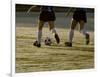 Low Section View of Two Female Soccer Players Kicking a Soccer Ball-null-Framed Photographic Print