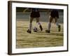 Low Section View of Two Female Soccer Players Kicking a Soccer Ball-null-Framed Photographic Print