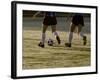 Low Section View of Two Female Soccer Players Kicking a Soccer Ball-null-Framed Photographic Print