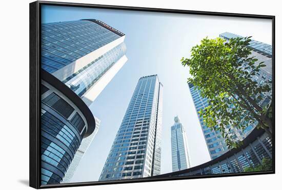 Low Wide Angle View of a Group of New Skyscrapers Combined with Fresh Greenery in Jianggan-Andreas Brandl-Framed Photographic Print