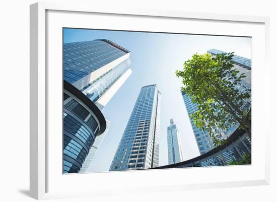 Low Wide Angle View of a Group of New Skyscrapers Combined with Fresh Greenery in Jianggan-Andreas Brandl-Framed Photographic Print