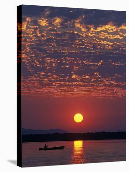 Lower Zambesi National Park, Canoeing on the Zambezi River at Sun Rise under a Mackerel Sky, Zambia-John Warburton-lee-Stretched Canvas