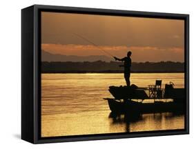 Lower Zambezi National Park, Fly Fishing for Tiger Fish from a Barge on the Zambezi River at Dawn, -John Warburton-lee-Framed Stretched Canvas