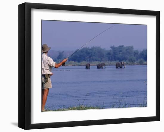 Lower Zambezi National Park, Fly-Fishing for Tiger Fish on the Zambezi River Against a Backdrop of -John Warburton-lee-Framed Premium Photographic Print