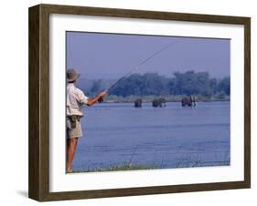 Lower Zambezi National Park, Fly-Fishing for Tiger Fish on the Zambezi River Against a Backdrop of -John Warburton-lee-Framed Photographic Print