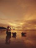 Woman with lamp and baskets on the beach, Phuket, Thailand-Luca Tettoni-Framed Photographic Print