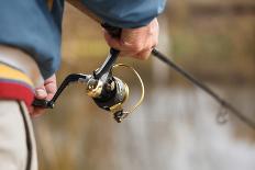 Closeup of Fisherman`S Hand with Spinning - Autumn Fishing Season.-luckyraccoon-Photographic Print