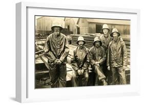 Lumberyard Workers in Rain Gear-null-Framed Art Print