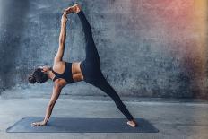 Woman Practicing Yoga in a Urban Background (Side Plank Pose, Vasisthasana)-Luna Vandoorne-Stretched Canvas