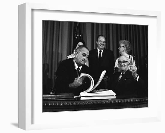 Lyndon Johnson Signing the Medicare Bill with Former President Truman, July 7,1965-null-Framed Photo