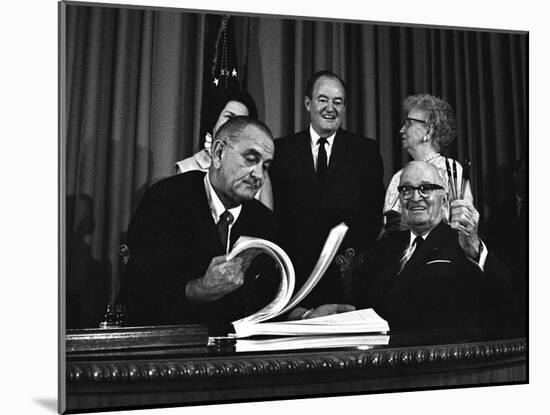 Lyndon Johnson Signing the Medicare Bill with Former President Truman, July 7,1965-null-Mounted Photo