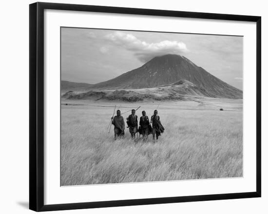 Maasai Warriors Stride across Golden Grass Plains at Foot of Ol Doinyo Lengai, 'Mountain of God'-Nigel Pavitt-Framed Photographic Print
