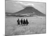 Maasai Warriors Stride across Golden Grass Plains at Foot of Ol Doinyo Lengai, 'Mountain of God'-Nigel Pavitt-Mounted Photographic Print