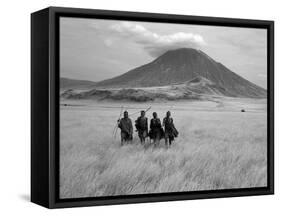 Maasai Warriors Stride across Golden Grass Plains at Foot of Ol Doinyo Lengai, 'Mountain of God'-Nigel Pavitt-Framed Stretched Canvas