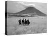 Maasai Warriors Stride across Golden Grass Plains at Foot of Ol Doinyo Lengai, 'Mountain of God'-Nigel Pavitt-Stretched Canvas