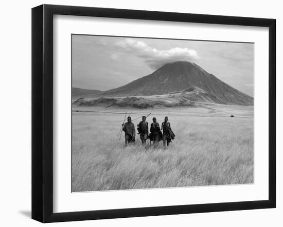 Maasai Warriors Stride across Golden Grass Plains at Foot of Ol Doinyo Lengai, 'Mountain of God'-Nigel Pavitt-Framed Premium Photographic Print