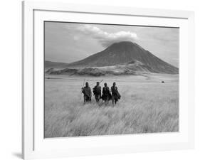 Maasai Warriors Stride across Golden Grass Plains at Foot of Ol Doinyo Lengai, 'Mountain of God'-Nigel Pavitt-Framed Photographic Print