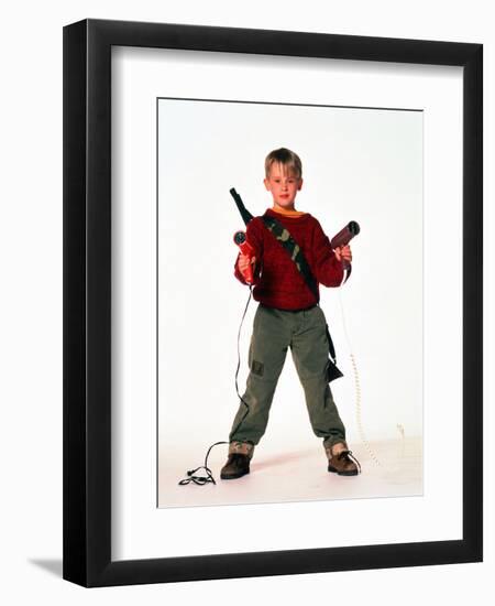 MACAULAY CULKIN. "HOME ALONE" [1990], directed by CHRIS COLUMBUS.-null-Framed Photographic Print