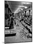 Macy's Department Store Employee Cleaning Up Piles of Debris after the Christmas Shopping Rush-Nina Leen-Mounted Photographic Print