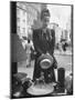 Maeve Brennan of Harper's Bazaar Looking Through Store Window-Nina Leen-Mounted Photographic Print