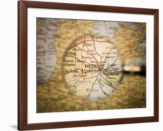 Magnifying Glass In Front Of A Detroit Map-gemenacom-Framed Art Print