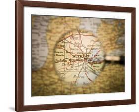 Magnifying Glass In Front Of A Detroit Map-gemenacom-Framed Art Print