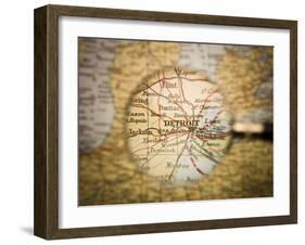 Magnifying Glass In Front Of A Detroit Map-gemenacom-Framed Art Print