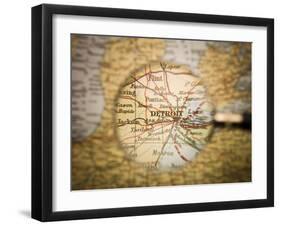 Magnifying Glass In Front Of A Detroit Map-gemenacom-Framed Art Print